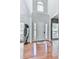 Bright foyer with hardwood floors, a high ceiling, a front door flanked by sidelights, and an arch window above the door at 907 Fox Croft Pl, Canton, GA 30114