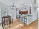 Eat-in kitchen features a breakfast bar, wood floors, and stainless steel appliances at 907 Fox Croft Pl, Canton, GA 30114