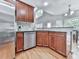 Kitchen features stainless steel appliances, cherry cabinets, and hardwood floors at 907 Fox Croft Pl, Canton, GA 30114