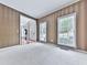 Bright carpeted living room featuring neutral walls, many windows letting in natural light, and an entryway at 907 Fox Croft Pl, Canton, GA 30114