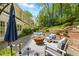 Outdoor patio with comfortable seating and an inviting fire pit at 998 Ferncliff Ne Rd, Atlanta, GA 30324