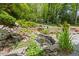 Backyard waterfall and tiered garden beds. Beautiful landscaping! at 998 Ferncliff Ne Rd, Atlanta, GA 30324