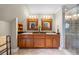 Stylish bathroom boasts a double vanity and walk-in glass shower with tile surround at 998 Ferncliff Ne Rd, Atlanta, GA 30324