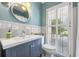 Charming bathroom featuring a blue vanity and lots of natural light at 998 Ferncliff Ne Rd, Atlanta, GA 30324