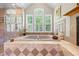 Bright bathroom features soaking tub, shower, and windows for plenty of natural light at 998 Ferncliff Ne Rd, Atlanta, GA 30324