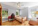 Cozy bedroom with hardwood floors, ceiling fan, and bright windows at 998 Ferncliff Ne Rd, Atlanta, GA 30324