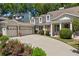 Charming home with a two-car garage, flower garden, well-maintained landscaping and a spacious driveway at 998 Ferncliff Ne Rd, Atlanta, GA 30324