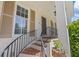 Charming front porch with brick steps and black iron railing detail, offering a warm welcome at 998 Ferncliff Ne Rd, Atlanta, GA 30324