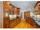 Spacious kitchen featuring wooden cabinets, stainless steel appliances, and hardwood floors at 998 Ferncliff Ne Rd, Atlanta, GA 30324