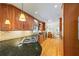 Kitchen with hardwood floors, wood cabinets, granite counters, and stainless appliances at 998 Ferncliff Ne Rd, Atlanta, GA 30324