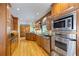 Well-equipped kitchen with wood cabinets, stainless appliances including a microwave and oven at 998 Ferncliff Ne Rd, Atlanta, GA 30324