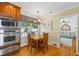 Eat-in kitchen with stainless appliances, wood table and view to the backyard at 998 Ferncliff Ne Rd, Atlanta, GA 30324