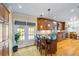 Well-lit kitchen features wood cabinets, island with bar seating, stainless steel appliances, and access to the outdoors at 998 Ferncliff Ne Rd, Atlanta, GA 30324