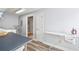 Neutral colored laundry room featuring ample counter space, full sized iron and clothes rack at 998 Ferncliff Ne Rd, Atlanta, GA 30324
