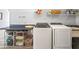 Functional laundry room with modern washer and dryer units and storage at 998 Ferncliff Ne Rd, Atlanta, GA 30324