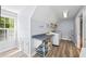 Bright laundry room with counter, shelving, appliances and large window overlooking the outdoors at 998 Ferncliff Ne Rd, Atlanta, GA 30324