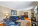 Interior view of the living room with hardwood flooring and a blue leather sofa at 998 Ferncliff Ne Rd, Atlanta, GA 30324