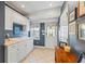 Mudroom with white cabinets, sink, and access to the backyard, offering a practical and stylish transition space at 998 Ferncliff Ne Rd, Atlanta, GA 30324