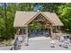 Outdoor structure overlooking the grounds, featuring a stone base and peaked roof at 998 Ferncliff Ne Rd, Atlanta, GA 30324