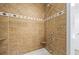 Close-up of a tiled shower with modern fixtures at 998 Ferncliff Ne Rd, Atlanta, GA 30324
