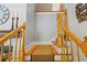 A carpeted staircase features natural wood banisters and painted risers creating a warm and inviting transition between levels at 998 Ferncliff Ne Rd, Atlanta, GA 30324