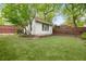 Well-maintained backyard with new turf, landscaping, fence, and a bright, modern outbuilding at 224 Kings Hwy, Decatur, GA 30030