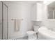 White bathroom features a shower, toilet, sink with vanity, and black and white tiled floors at 224 Kings Hwy, Decatur, GA 30030