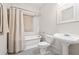 Bright bathroom featuring a classic clawfoot tub, pedestal sink, and stylish black and white tile floor at 224 Kings Hwy, Decatur, GA 30030