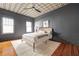 Bedroom with hardwood floors, unique ceiling design with ceiling fan, and a comfortable bed at 224 Kings Hwy, Decatur, GA 30030