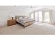 Airy bedroom boasting a woven platform bed, plush carpeting, and ample natural light through draped windows at 224 Kings Hwy, Decatur, GA 30030