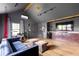 Stylish bonus room with hardwood floors, comfortable seating, built-in cabinets, and large screen television at 224 Kings Hwy, Decatur, GA 30030