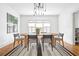 Elegant dining room featuring a wooden table, modern chairs, and a designer light fixture at 224 Kings Hwy, Decatur, GA 30030