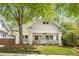 Charming white brick home featuring a welcoming front porch and beautifully landscaped front yard at 224 Kings Hwy, Decatur, GA 30030