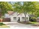 Quaint white home with a welcoming front porch, mature trees, and a charming driveway at 224 Kings Hwy, Decatur, GA 30030