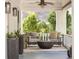 Inviting porch with comfortable seating, stylish decor, and a ceiling fan for warm days at 224 Kings Hwy, Decatur, GA 30030
