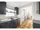 Modern kitchen featuring dark cabinets, quartz countertops, wine fridge, and breakfast nook access at 224 Kings Hwy, Decatur, GA 30030