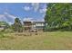 Spacious backyard with a wooden deck, ideal for outdoor entertaining and enjoying the serene natural surroundings at 2675 Dacula Ridge Dr, Dacula, GA 30019