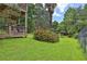 Expansive backyard featuring lush greenery, mature trees, and a charming deck, perfect for outdoor living and entertaining at 2675 Dacula Ridge Dr, Dacula, GA 30019