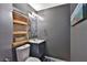Powder room with sink, toilet and decorative mirror at 2675 Dacula Ridge Dr, Dacula, GA 30019