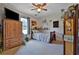 Cozy bedroom featuring a ceiling fan and a window that provides plenty of natural light at 2675 Dacula Ridge Dr, Dacula, GA 30019