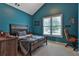 Comfortable bedroom with a modern bed, desk, chair, and a large window with natural light at 2675 Dacula Ridge Dr, Dacula, GA 30019