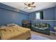 Blue bedroom offers ceiling fan, bed, and desk at 2675 Dacula Ridge Dr, Dacula, GA 30019