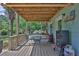 Relaxing outdoor deck area complete with dining set, bbq, and propane tank perfect for outdoor entertaining at 2675 Dacula Ridge Dr, Dacula, GA 30019