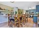 Eat-in kitchen featuring stainless steel appliances, hardwood floors, and custom cabinetry at 2675 Dacula Ridge Dr, Dacula, GA 30019