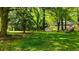A large, tree-filled backyard provides a serene and private setting for the home at 754 Pinehill Se Dr, Smyrna, GA 30080