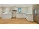Partially finished basement with vinyl flooring, stainless steel refrigerator, sink, and washer-dryer hookups at 754 Pinehill Se Dr, Smyrna, GA 30080