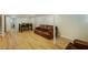 Finished basement with light wood flooring, dining table, and leather couch at 754 Pinehill Se Dr, Smyrna, GA 30080
