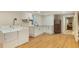 Partially finished basement with vinyl flooring, stainless steel refrigerator, sink, and washer-dryer hookups at 754 Pinehill Se Dr, Smyrna, GA 30080