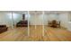 Spacious basement with laminate flooring, support columns, and an area for dining and entertaining at 754 Pinehill Se Dr, Smyrna, GA 30080