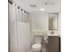 Neutral basement bathroom features a shower, toilet, and vanity at 754 Pinehill Se Dr, Smyrna, GA 30080